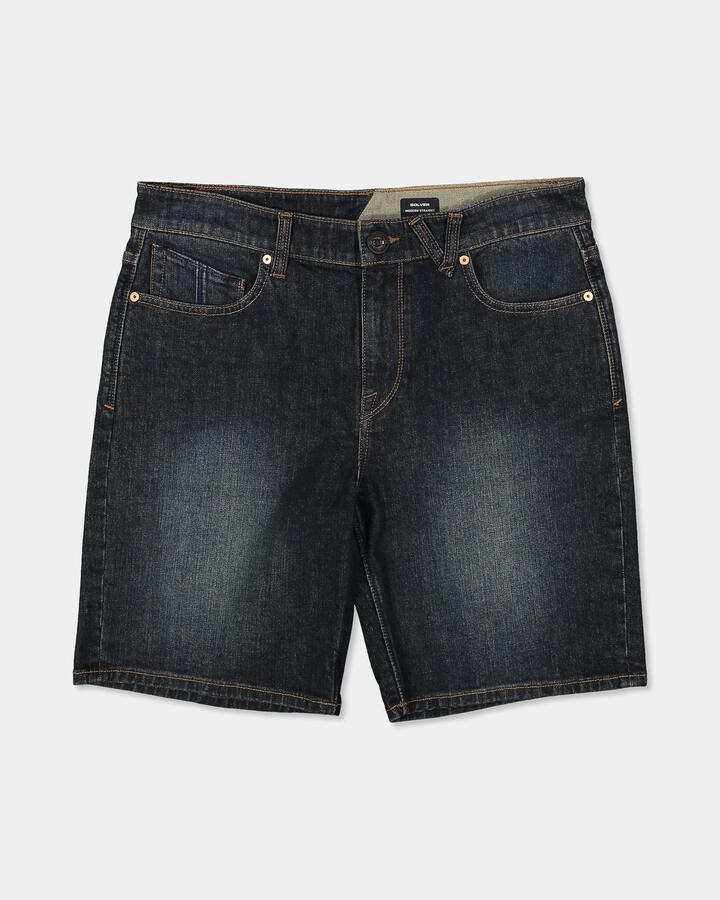 Image of a model wearing Shorts. Product name - Volcom Mens Solver 20" Denim Shorts New Vintage Blue in New Vintage Blue colour by brand - Volcom