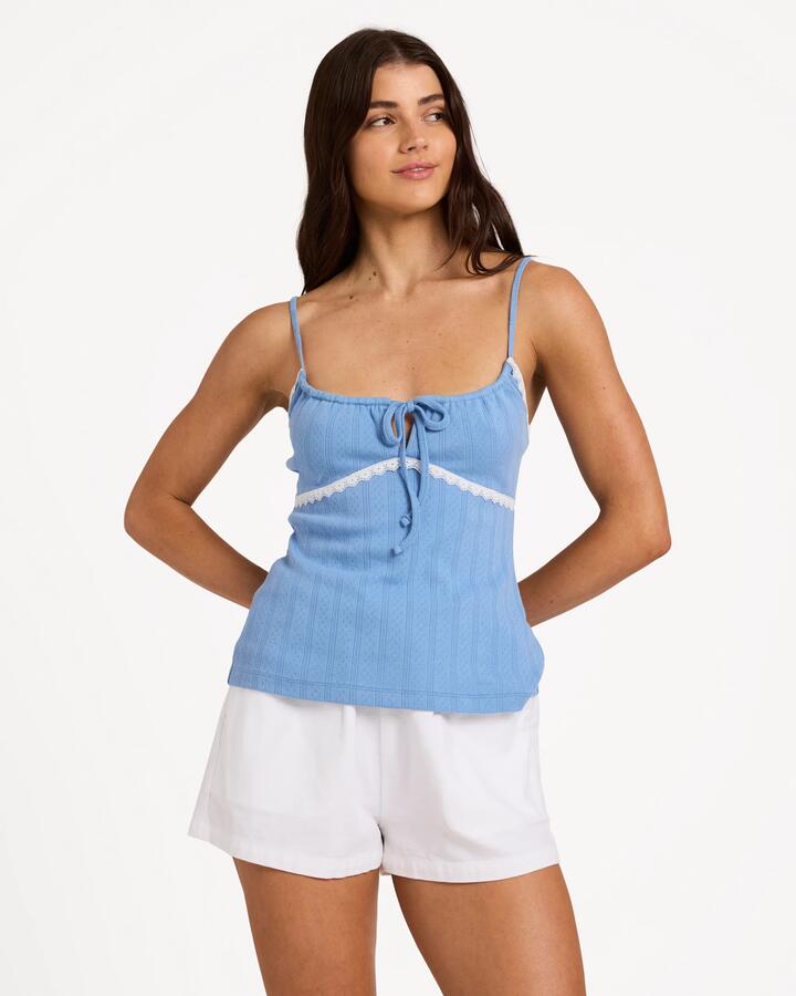 Image of a model wearing Tops. Product name - Billabong Womens Blue Horizon Tank Top Blue Horizon in Blue Horizon colour by brand - Billabong