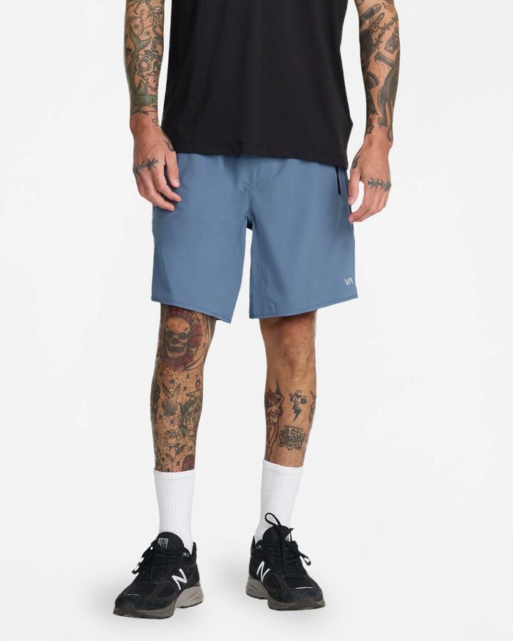Image of a model wearing Shorts. Product name - Rvca Mens Yogger Stretch 17" Sports Shorts Vintage Navy in Vintage Navy colour by brand - Rvca
