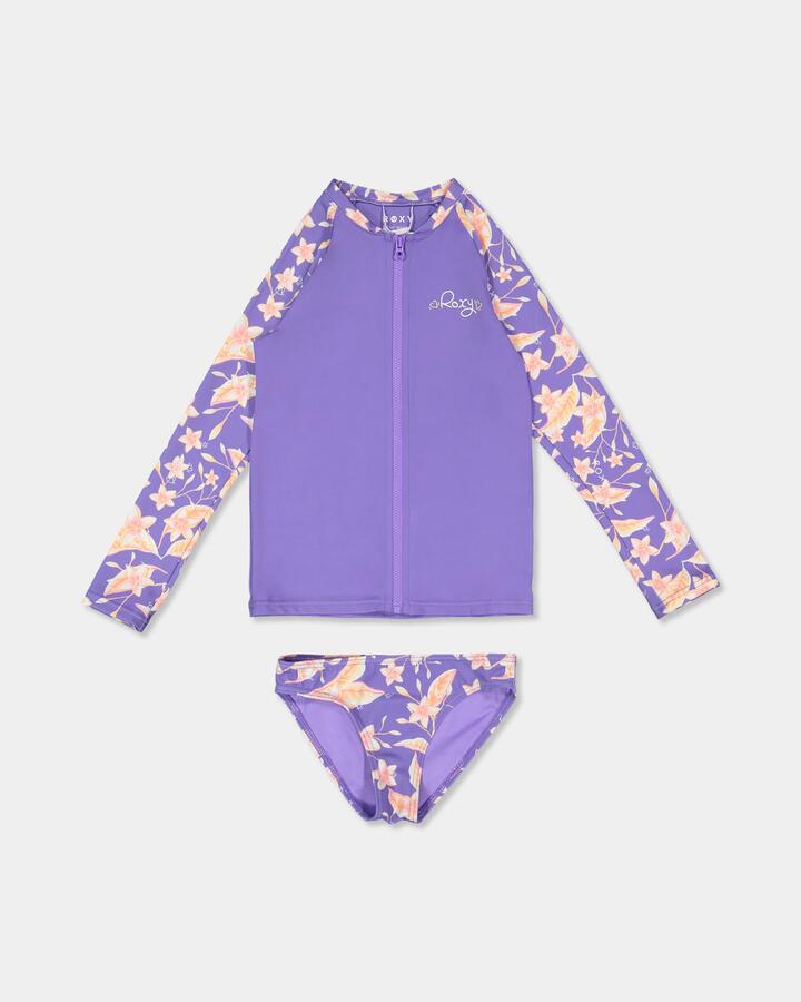 Image of a model wearing Tops. Product name - Roxy Girls 2-7 Plumeria Love Long Sleeve Rashguard Dahlia Purple Plumeria Love in Dahlia Purple Plumeria Love colour by brand - Roxy
