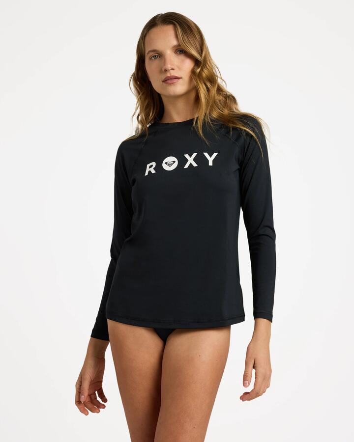 Image of a model wearing Tops. Product name - Roxy Womens Essentials Long Sleeve Rashguard Anthracite in Anthracite colour by brand - Roxy