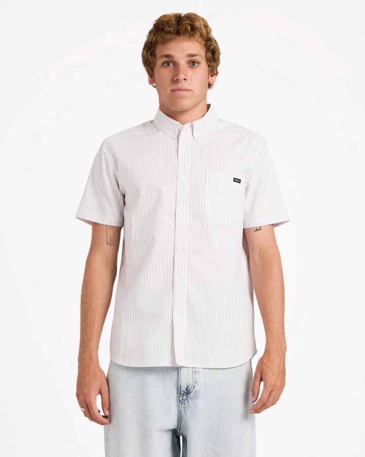 Image of a model wearing Tops. Product name - Rvca Mens Rvca Pinstripe Short Sleeve Shirt Gold in Gold colour by brand - Rvca