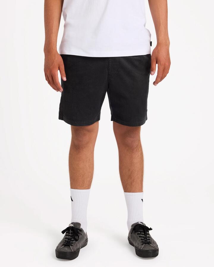 Image of a model wearing Shorts. Product name - Rvca Mens Escape Elastic Cord 17" Elastic Waist Shorts Black in Black colour by brand - Rvca