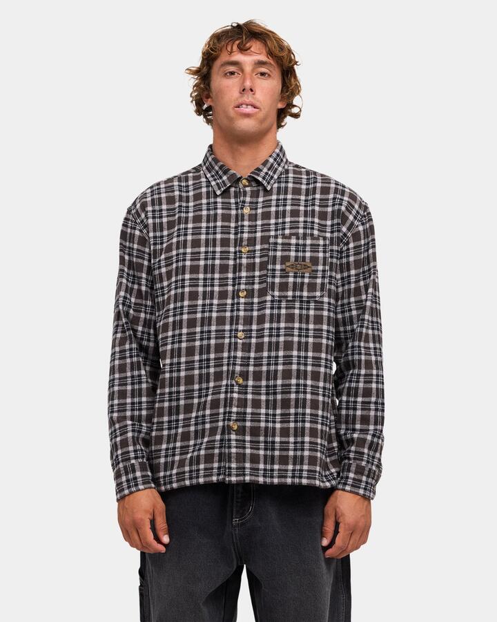 Image of a model wearing Tops. Product name - Billabong Mens Immortal Flannel Long Sleeve Shirt Black in Black colour by brand - Billabong