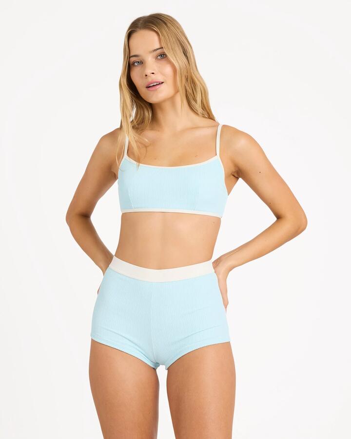 Image of a model wearing Tops. Product name - Billabong Womens Sunrays Mia Dd Bralette Bikini Top Clearwater in Clearwater colour by brand - Billabong