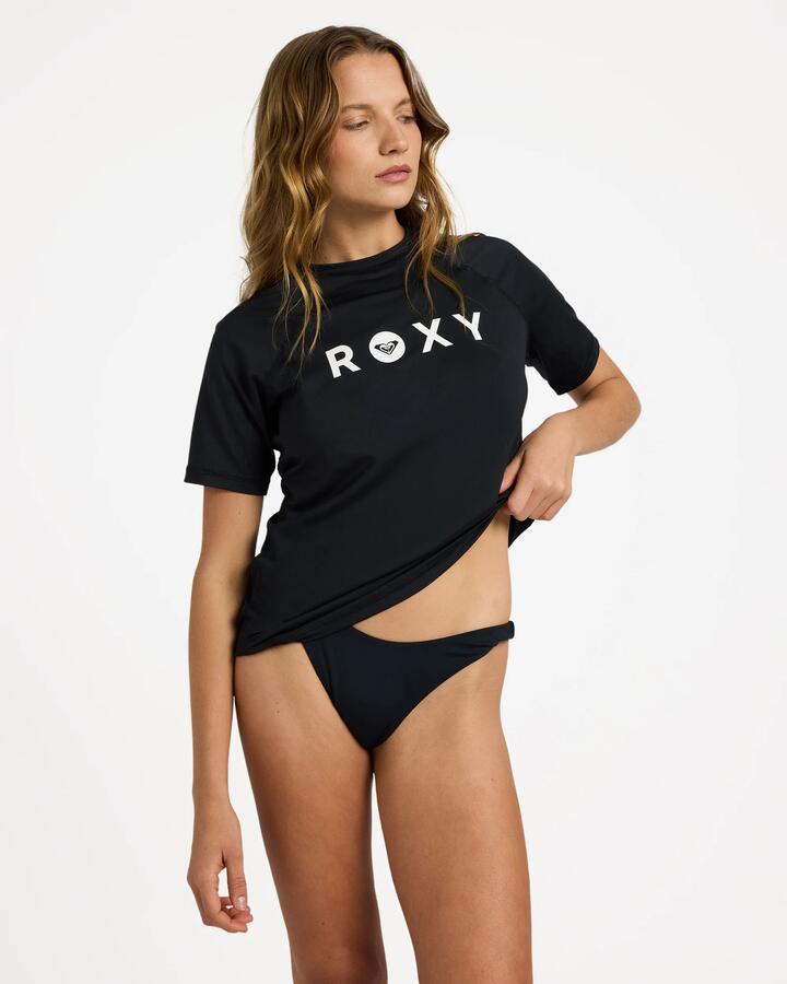 Image of a model wearing Tops. Product name - Roxy Womens Essentials Short Sleeve Rashguard Anthracite in Anthracite colour by brand - Roxy