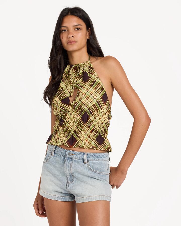 Image of a model wearing Tops. Product name - Rvca Womens Harper Halter Top Chocolate in Chocolate colour by brand - Rvca