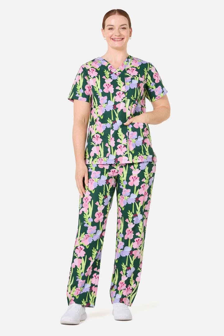 Image of a model wearing Uniforms & Workwear. Product name - Gladioli Scrub Set in Green colour by brand - Gorman