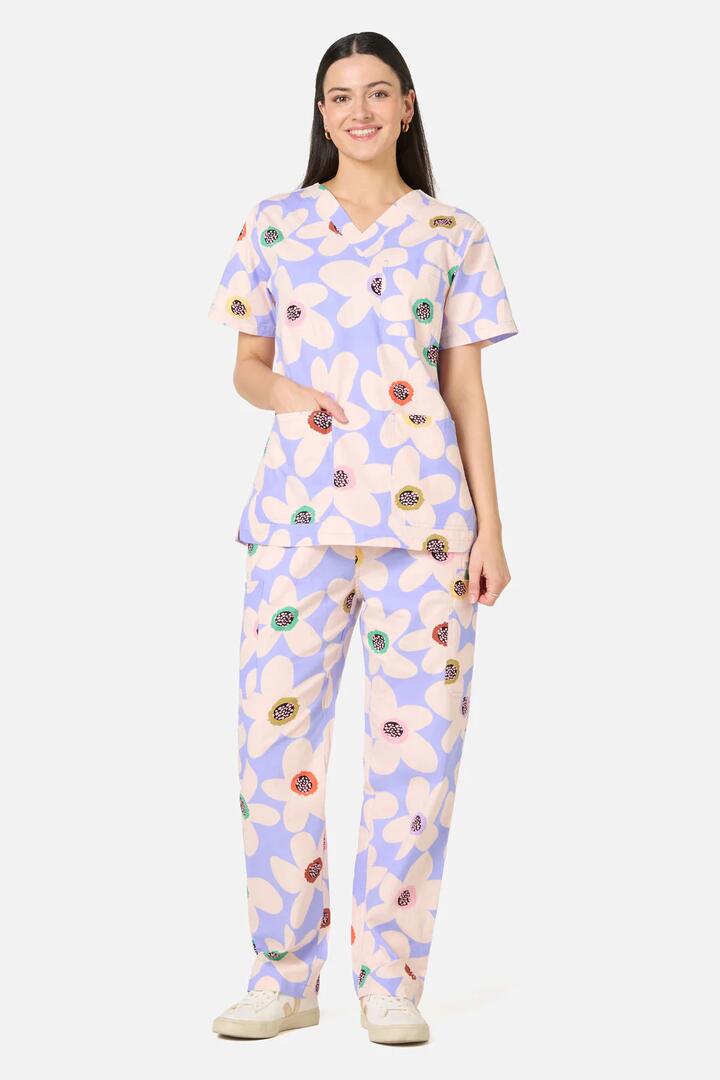 Image of a model wearing Uniforms & Workwear. Product name - Daisy Scrub Set in Lilac colour by brand - Gorman