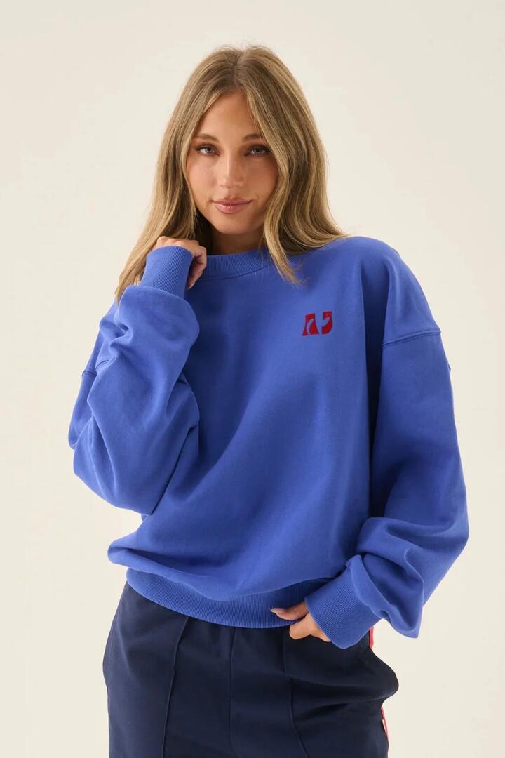 Image of a model wearing Outerwear. Product name - A James Cobalt Blue Sweatshirt in Blue colour by brand - Araminta James