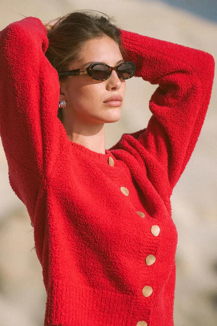 Image of a model wearing Outerwear. Product name - Aimes Shell Deep Coral Cardigan in Red colour by brand - Araminta James