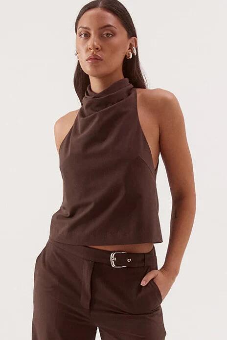 Image of a model wearing Tops. Product name - Amorey Espresso High Neck Sleeveless Top in Brown colour by brand - Sovere