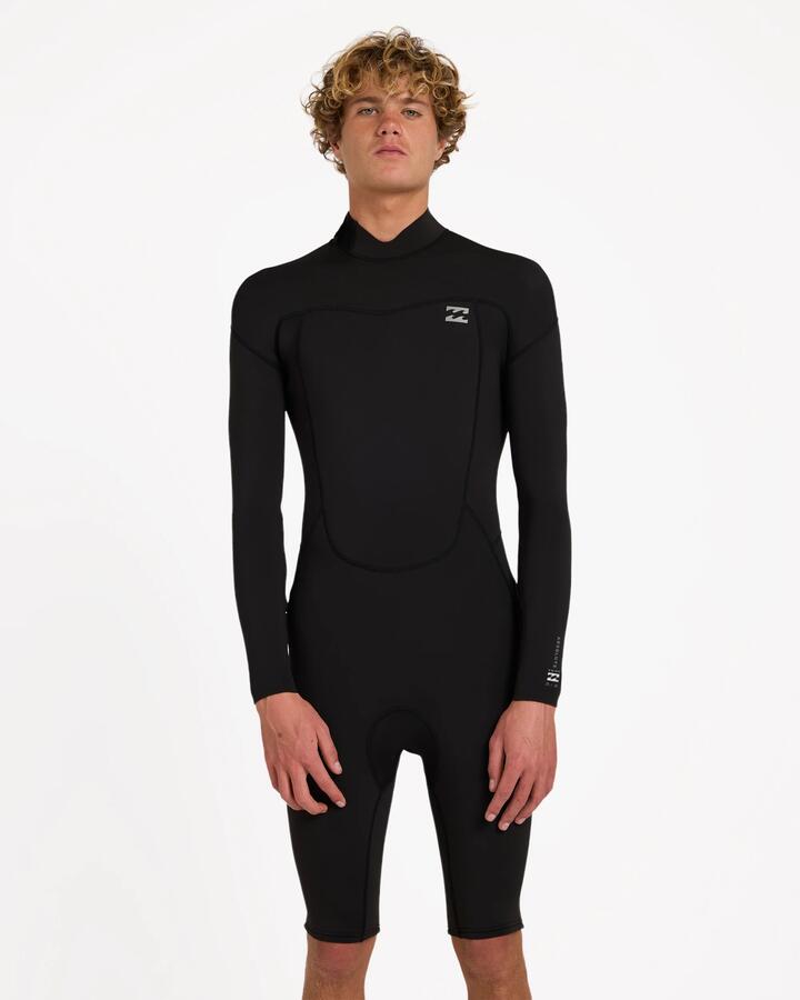 Image of a model wearing Tops. Product name - Billabong Mens 2/2 Absolute Long Sleeve Springsuit Black in Black colour by brand - Billabong