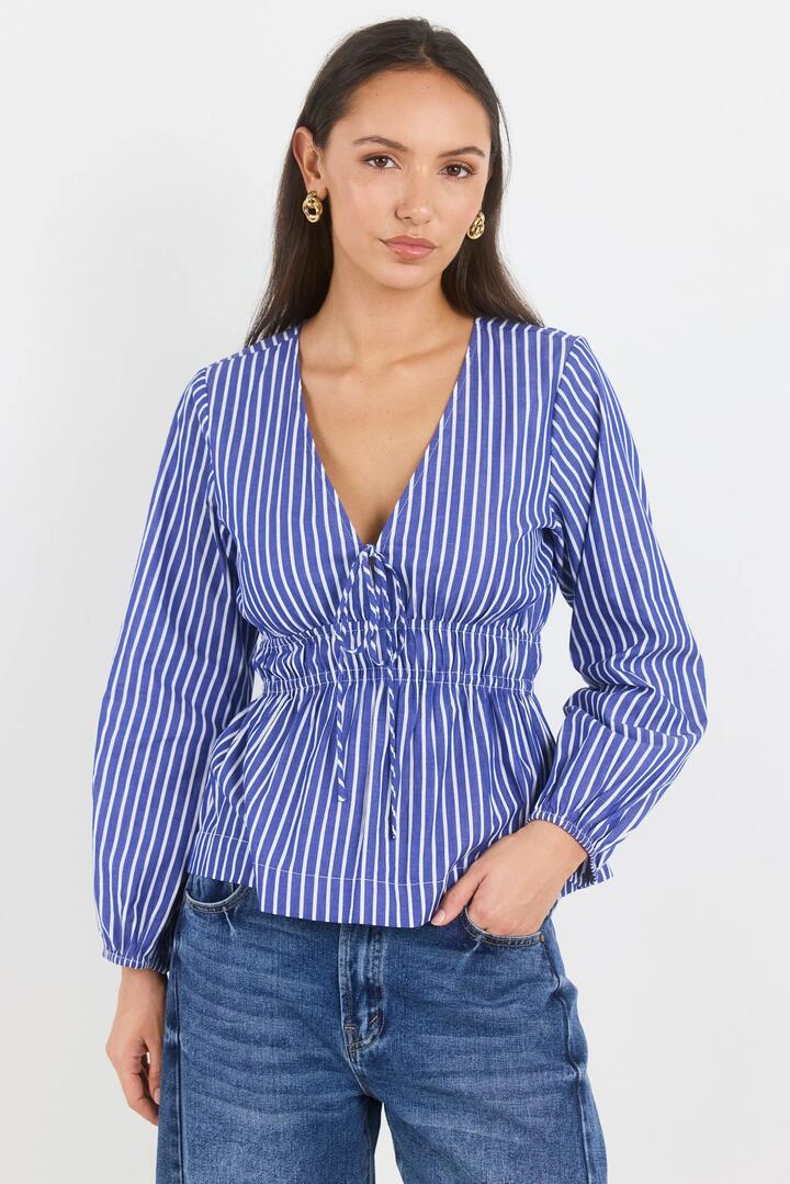 Image of a model wearing Tops. Product name - Belief Blue Stripe V Neck Fit and Flare Long Sleeve Top in Blue Stripe colour by brand - Ivy + Jack
