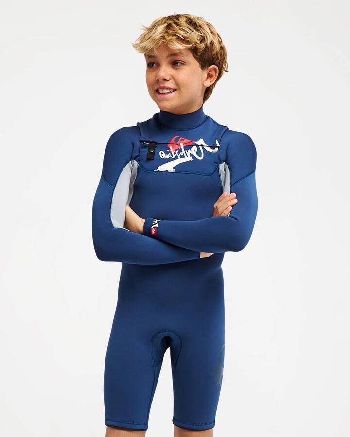 Image of a model wearing Tops. Product name - Quiksilver Boys 8-16 Young Guns 2/2Mm Long Sleeve Springsuit Dark Denim in Dark Denim colour by brand - Quiksilver