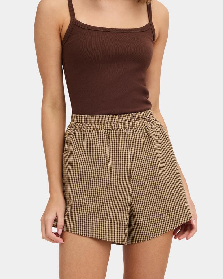 Image of a model wearing Shorts. Product name - Nunui Womens Chito Elastic Waist Shorts Chocolate in Chocolate colour by brand - Nunui
