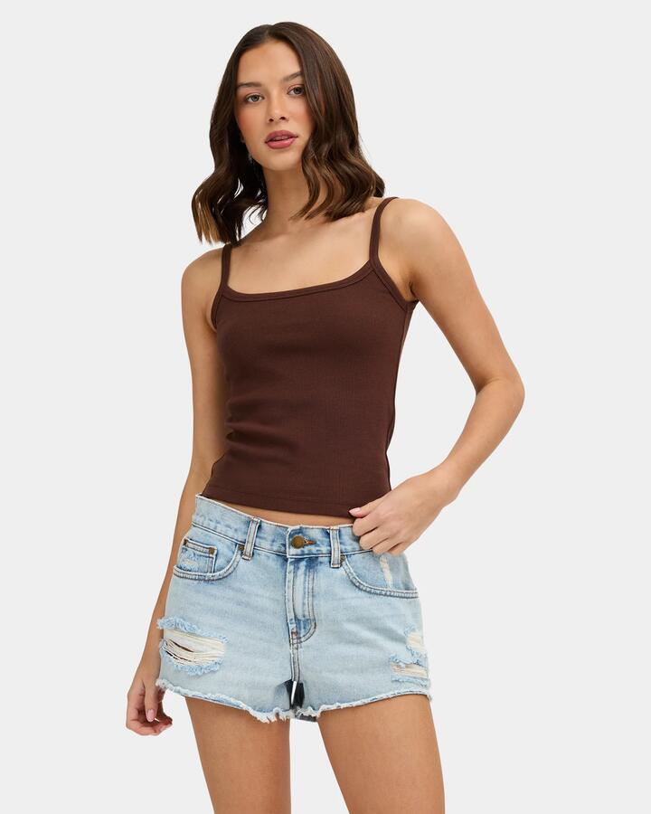 Image of a model wearing Tops. Product name - Nunui Womens The Ease Tank Top Chocolate in Chocolate colour by brand - Nunui