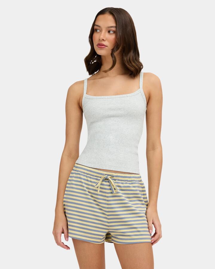 Image of a model wearing Tops. Product name - Nunui Womens The Ease Tank Top Grey Marle in Grey Marle colour by brand - Nunui