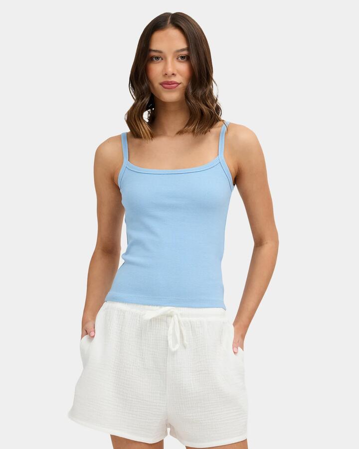 Image of a model wearing Tops. Product name - Nunui Womens The Ease Tank Top Steel Blue in Steel Blue colour by brand - Nunui