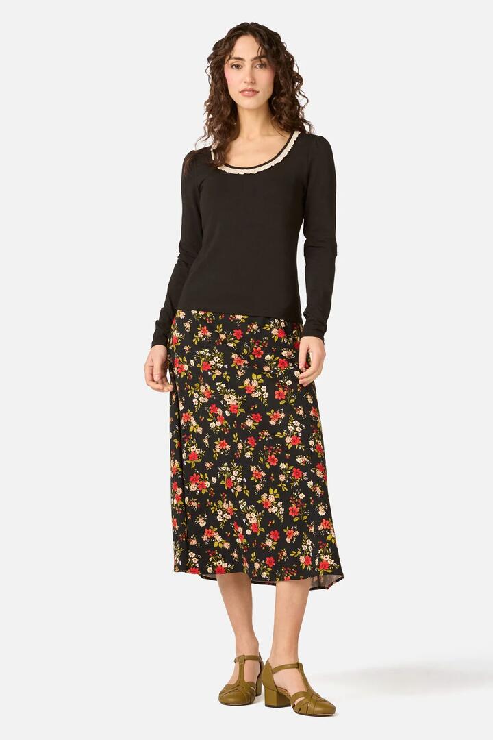 Image of a model wearing Skirts. Product name - Posy Floral Midi Skirt in Black colour by brand - Princess Highway
