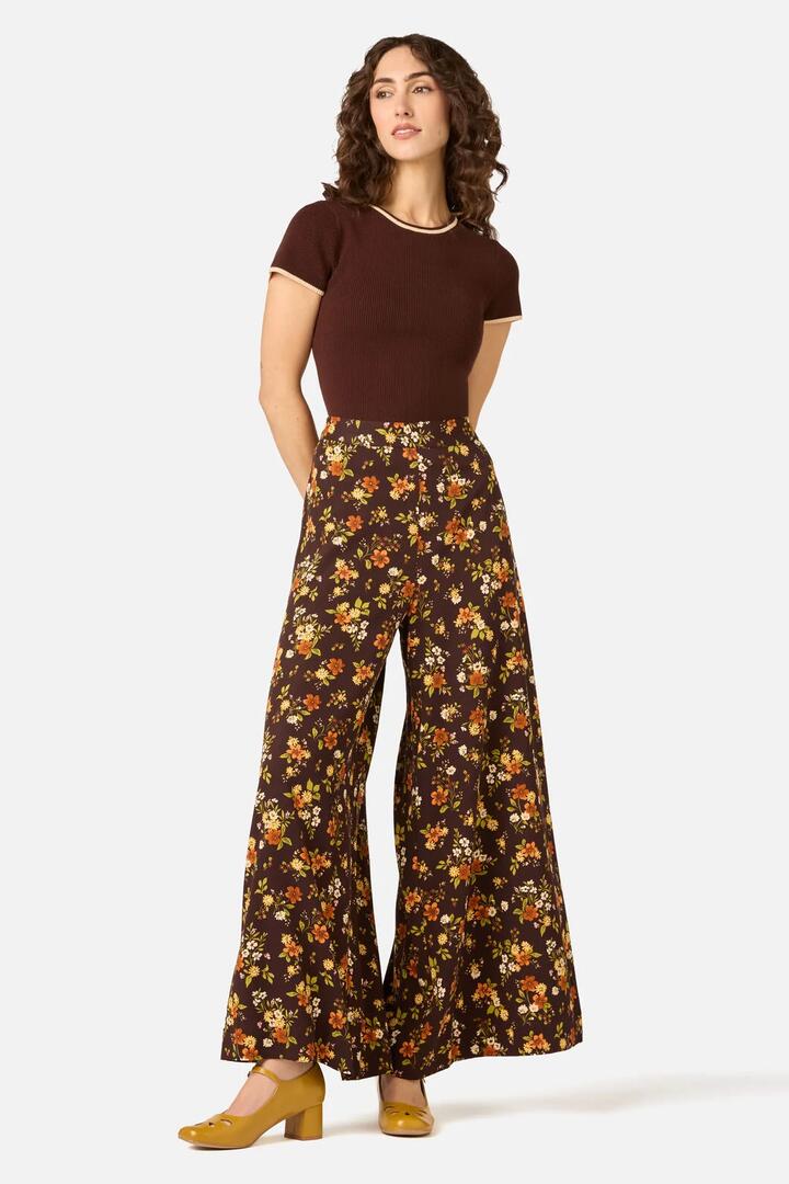 Image of a model wearing Pants. Product name - Posy Floral Wide Leg Pant in Chocolate colour by brand - Princess Highway