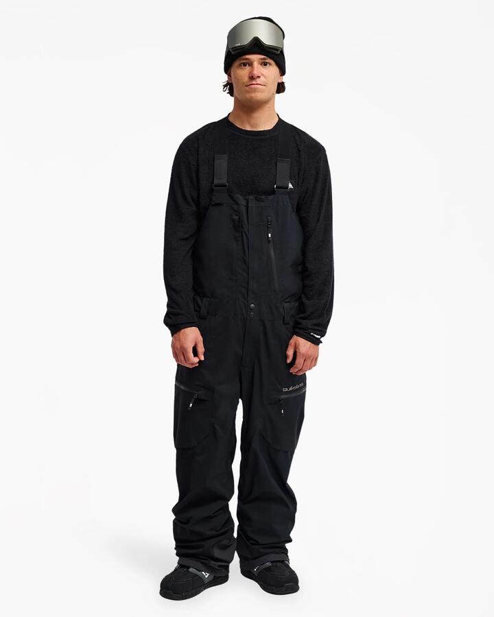 Image of a model wearing Pants. Product name - Quiksilver Mens Altostratus Stret Gore-Tex Bib Snow Pants Black in Black colour by brand - Quiksilver