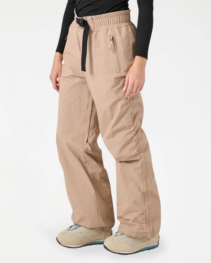 Image of a model wearing Pants. Product name - Roxy Womens Bleeker Snow Pants Chanterelle Tan in Chanterelle Tan colour by brand - Roxy