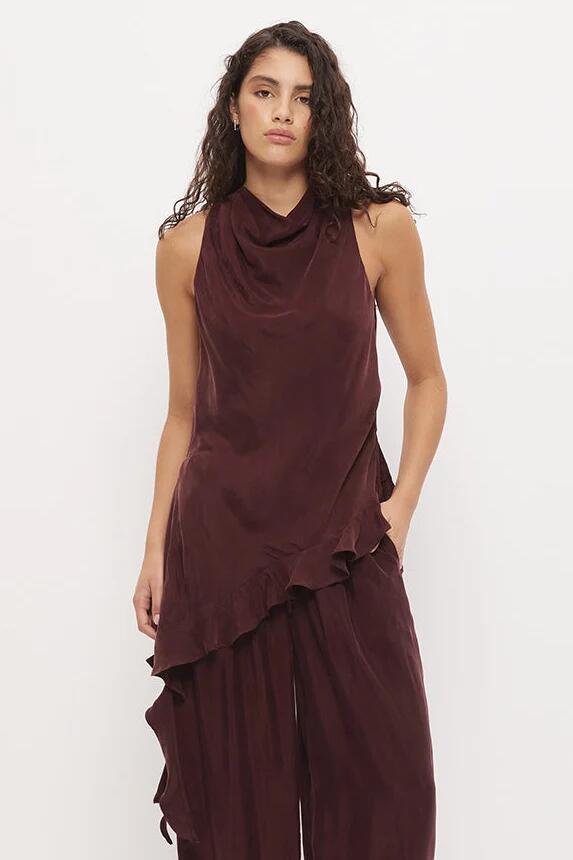 Image of a model wearing Tops. Product name - Eadie Chestnut Cowl Neck Asym Hem Ruffle Sleeveless Top in Brown colour by brand - Mon Renn