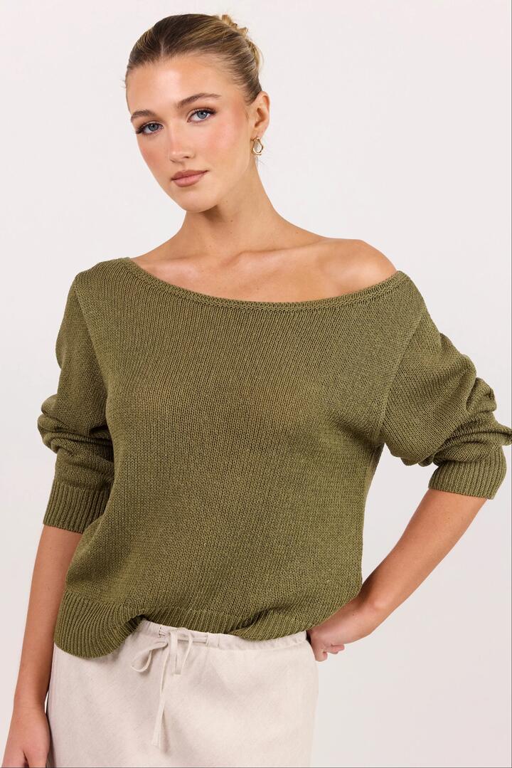 Image of a model wearing Outerwear. Product name - Eventide Khaki Off Shoulder Long Sleeve Jumper in Khaki colour by brand - Among the Brave
