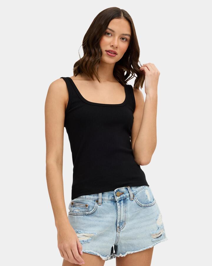 Image of a model wearing Tops. Product name - Nunui Womens Refine Me Tank Top Black in Black colour by brand - Nunui