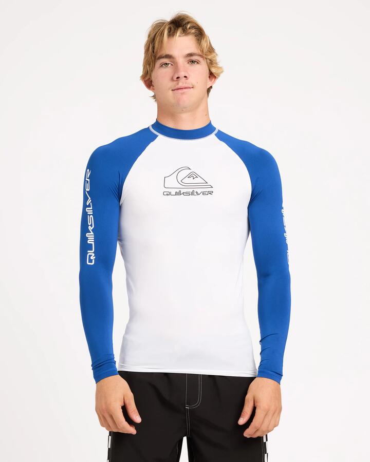 Image of a model wearing Tops. Product name - Surf Dive 'n Ski Mens On Tour Long Sleeve Id Rashguard White/Monaco Blue in White/Monaco Blue colour by brand - Surf Dive 'n Ski