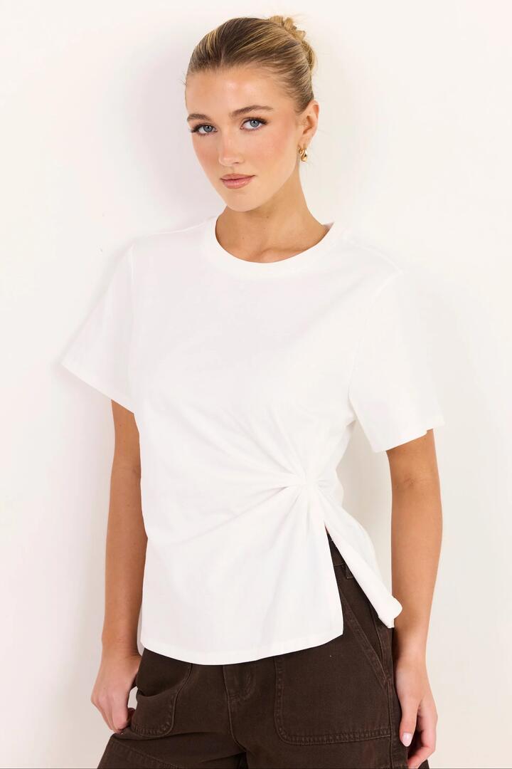 Image of a model wearing Tops. Product name - Rupture White Split Detail Tee in White colour by brand - Ivy + Jack