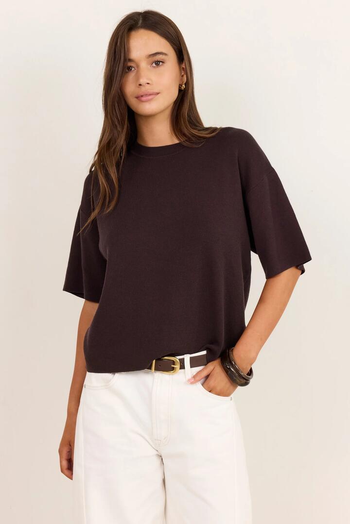 Image of a model wearing Outerwear. Product name - Intrepid Chocolate Relaxed Knit Tee in Chocolate colour by brand - Stories be Told