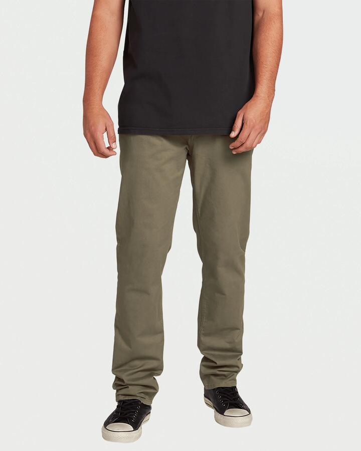 Image of a model wearing Pants. Product name - Volcom Mens Solver Lite 5 Pocket Pants Army Green Combo in Army Green Combo colour by brand - Volcom