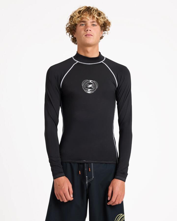 Image of a model wearing Tops. Product name - Billabong Mens Spec 73 Upf 50 Long Sleeve Rashguard Black in Black colour by brand - Billabong