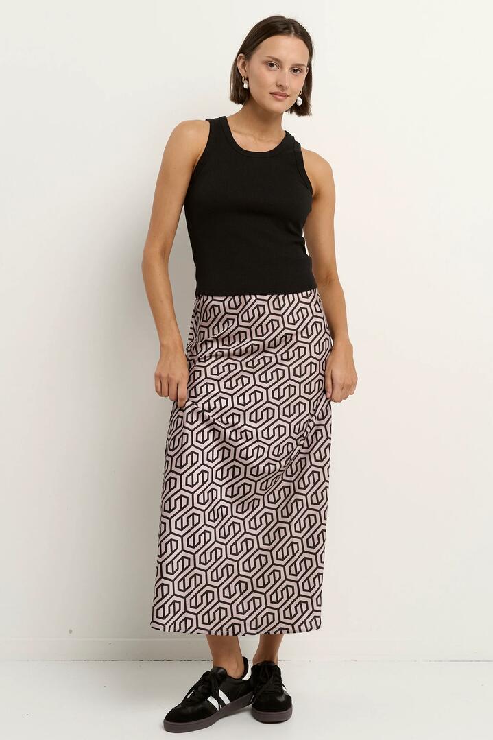 Image of a model wearing Skirts. Product name - Faithful Black Geo Print Satin Bias Maxi Skirt in Black Geo Print colour by brand - Stories be Told