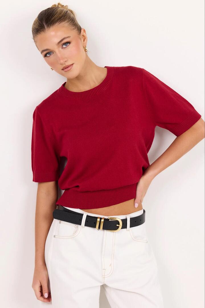 Image of a model wearing Outerwear. Product name - Topic Cherry Red Cashmere Blend Soft Knit Tee in Cherry Red colour by brand - Ivy + Jack