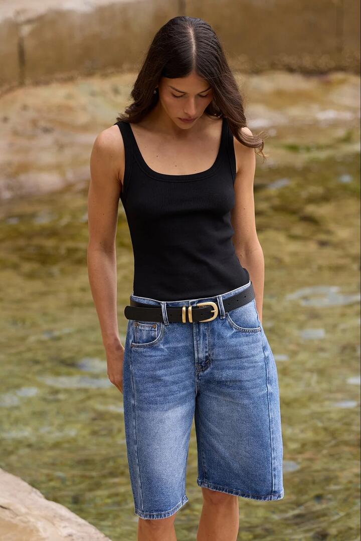 Image of a model wearing Shorts. Product name - Academy Deep Blue Denim Barrel Shorts in Deep Blue colour by brand - Among the Brave