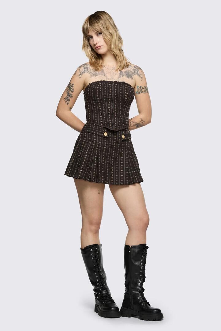 Image of a model wearing Skirts. Product name - Low Whisper Skort in Brown colour by brand - Black Friday