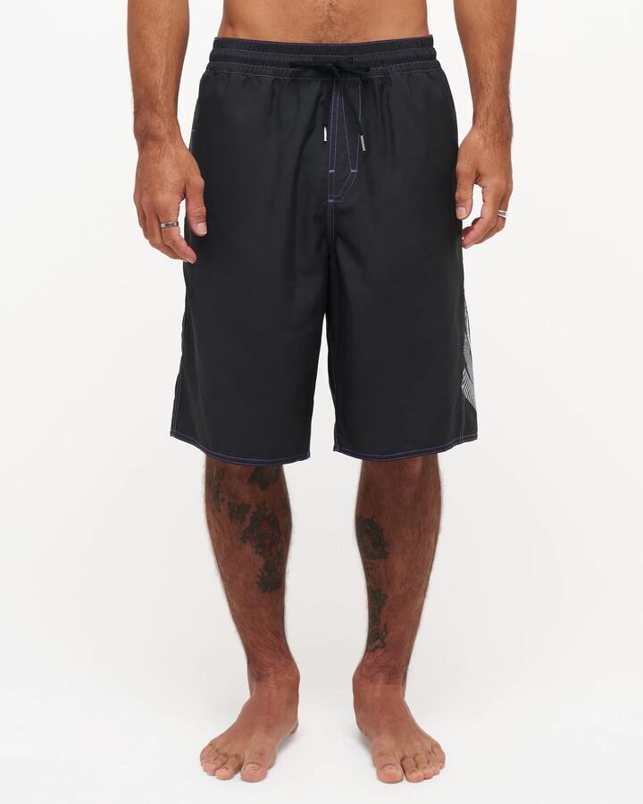 Image of a model wearing Shorts. Product name - Volcom Mens Reaper 21" Volley Shorts Black in Black colour by brand - Volcom