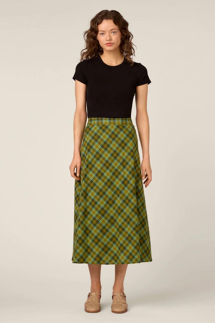 Image of a model wearing Skirts. Product name - Edwina Check A-Line Midi Skirt in Green colour by brand - Princess Highway