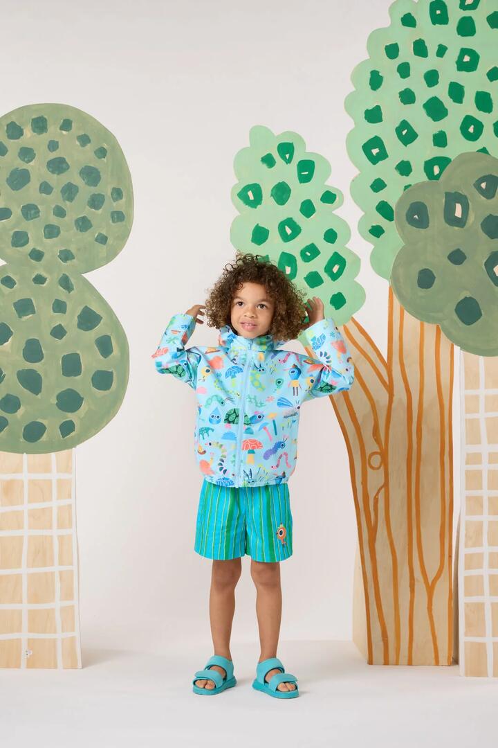 Image of a model wearing Rain Coats. Product name - Garden Pals Kids Raincoat in Blue colour by brand - Gorman