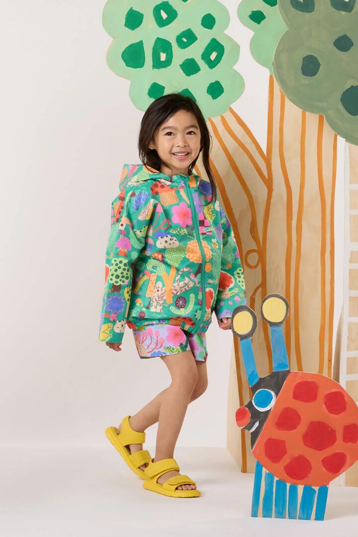 Image of a model wearing Rain Coats. Product name - Woodend Kids Raincoat in Green colour by brand - Gorman