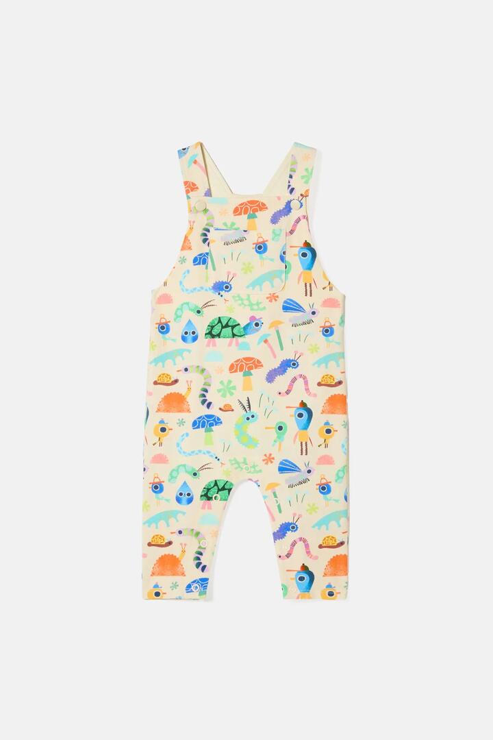 Image of a model wearing Pants. Product name - Garden Pals Baby Overalls in Cream colour by brand - Gorman