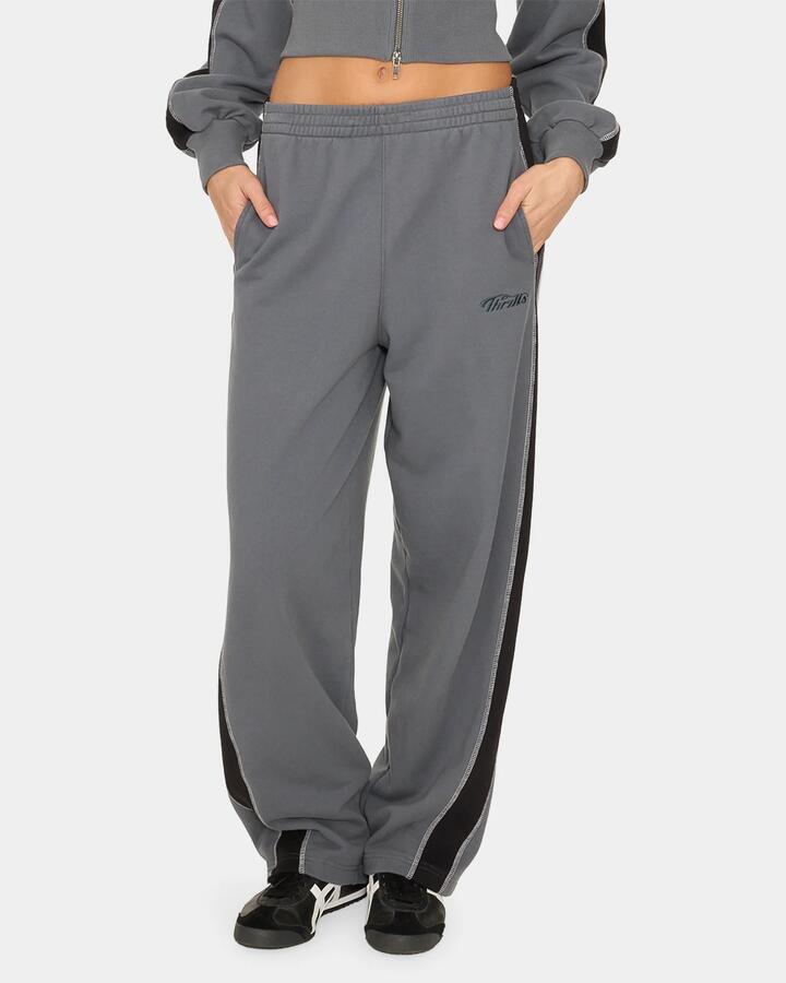 Image of a model wearing Pants. Product name - Thrills Division 011 Panelled Track Pant P62 Petrol in Petrol colour by brand - Thrills