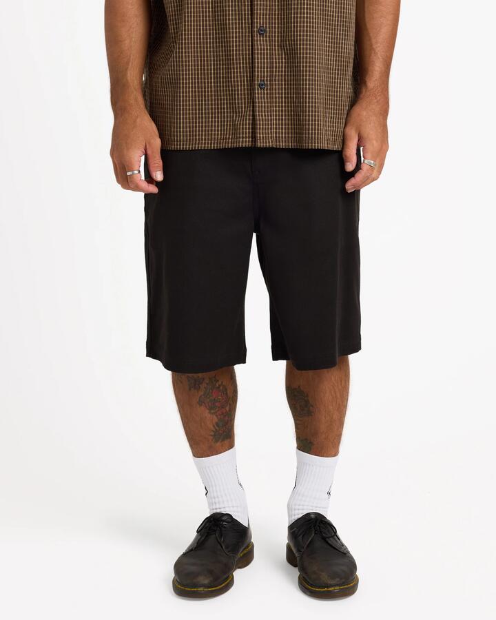 Image of a model wearing Shorts. Product name - Volcom Mens Billow 22" Chino Shorts Black in Black colour by brand - Volcom