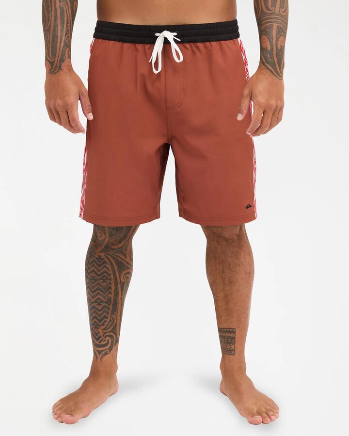 Image of a model wearing Shorts. Product name - Quiksilver Mens Tai Kehu Arch 18" Volley Shorts Henna in Henna colour by brand - Quiksilver