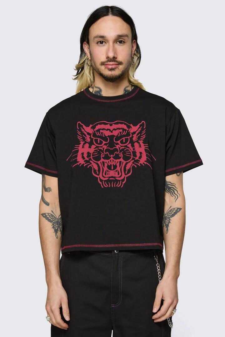 Image of a model wearing Tops. Product name - Big Cat Crop Tee in Black colour by brand - Dangerfield