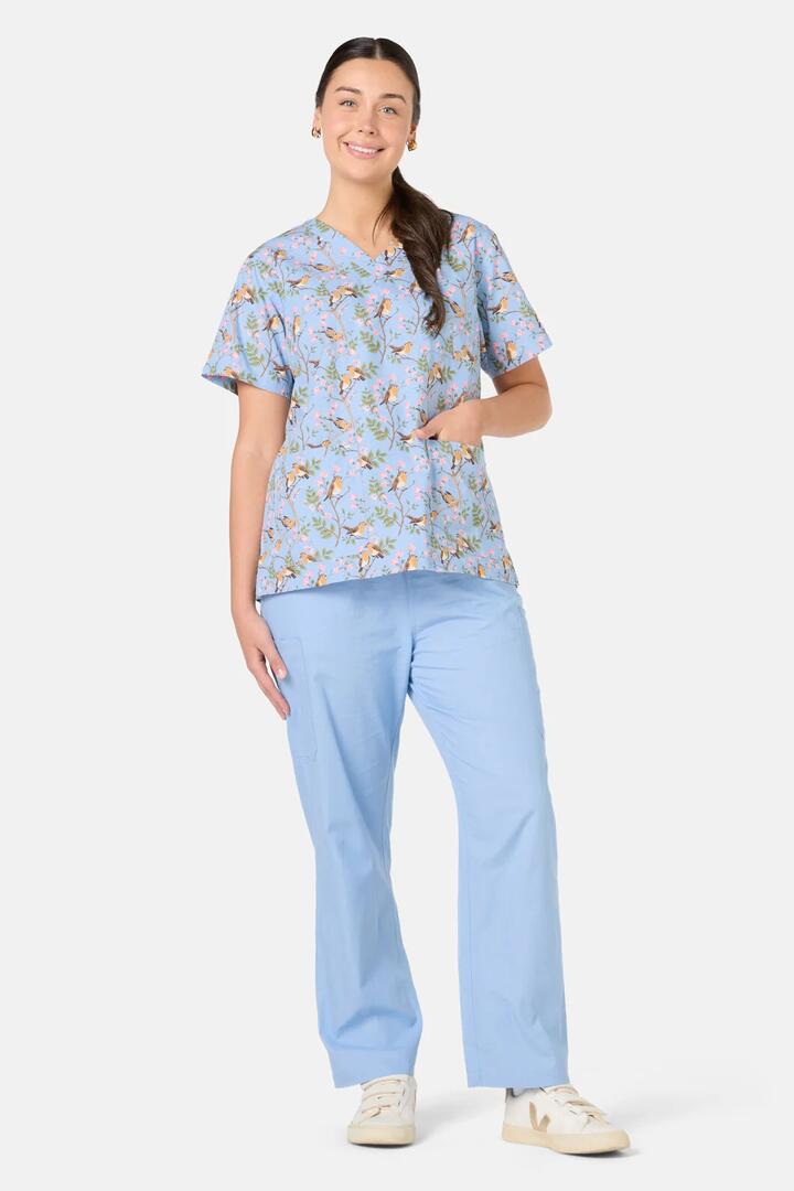 Image of a model wearing Uniforms & Workwear. Product name - Robin Mixed Scrub Set in Light Blue colour by brand - Scrubs With Love
