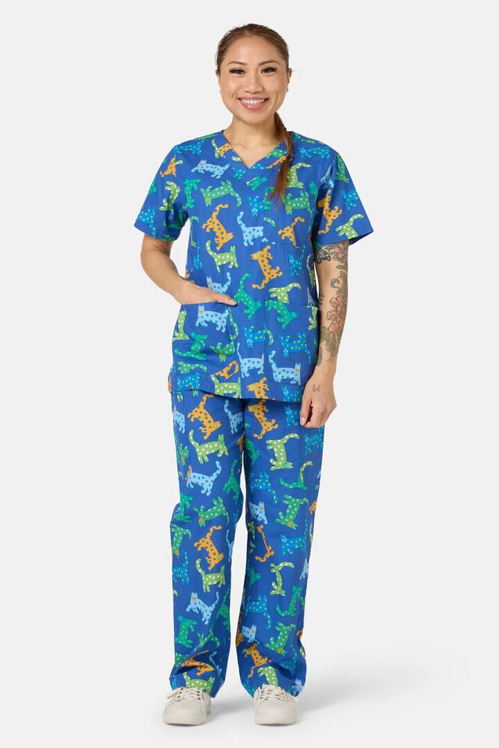 Image of a model wearing Uniforms & Workwear. Product name - Spotty Cats Scrub Set in Navy colour by brand - Gorman